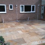 Wide view of the completed patio with complementary lighting.