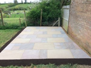 The Indian Sandstone shed base / patio when completed in Walgrave.