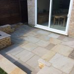 Close up of the sandstone patio area by the sandstone retaining wall.